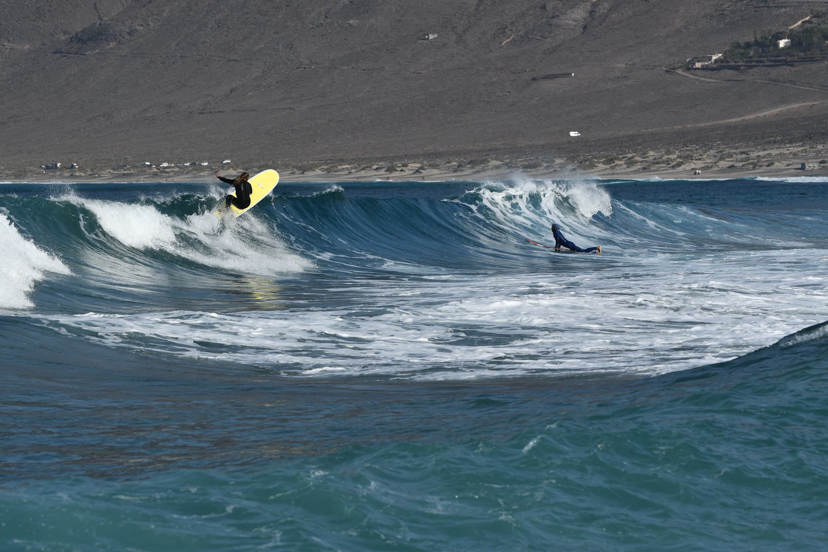 Jimmy Lewis board riding a wave